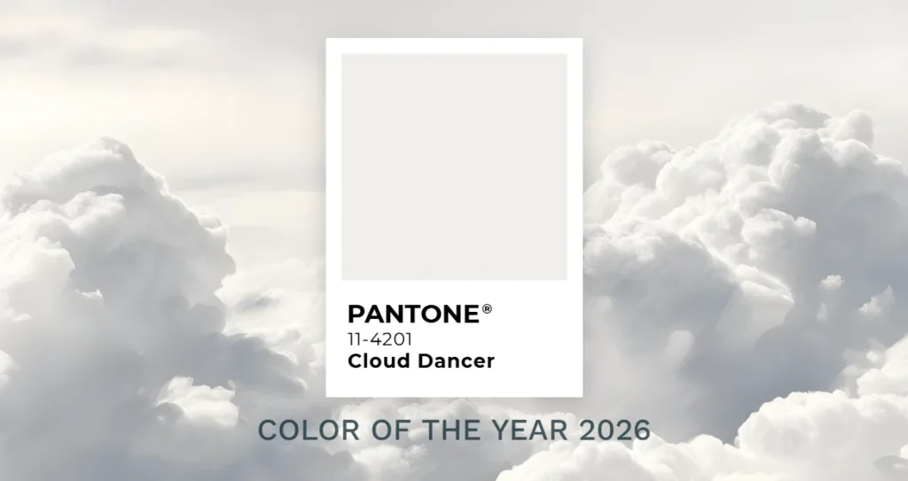 Pantone Color of the Year 2026 Cloud Dancer (11-4201) showcased against soft, billowing white clouds, highlighting an airy, calm, and minimalist palette with a serene atmospheric feel.