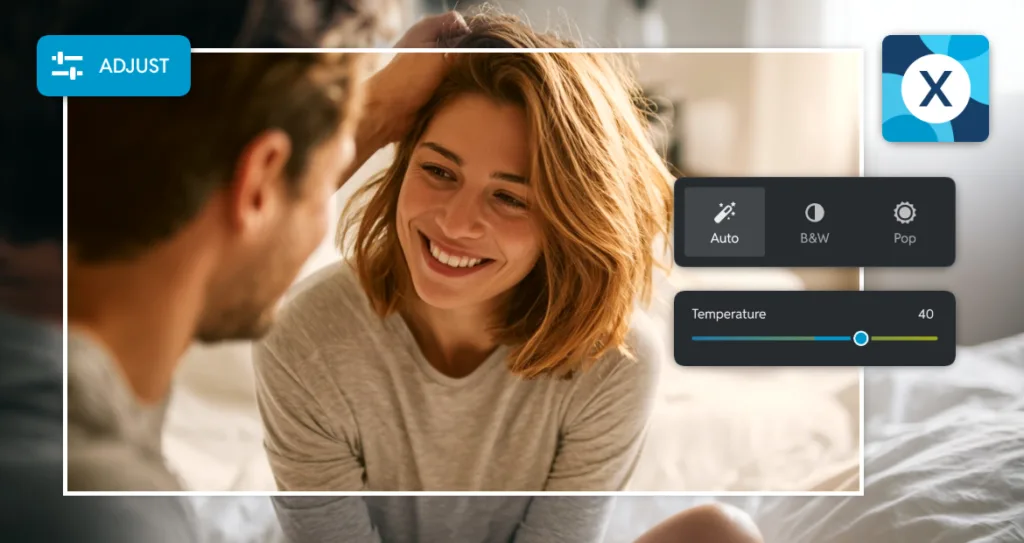 A woman smiling warmly at her partner while adjusting photo settings in an image editor, with temperature and filter controls visible on screen.