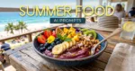 A vibrant acai smoothie bowl topped with sliced bananas, strawberries, blueberries, kiwi, mango, passion fruit, granola, coconut flakes, mint leaves, and edible flowers sits on a rustic wooden table overlooking a sunny beach. The image features the text "SUMMER FOOD AI PROMPTS" at the top, with a seaside café setting and ocean view in the background.